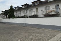 Nachher - Verputz- und Anstrich Außenmauer Rüsselsheim